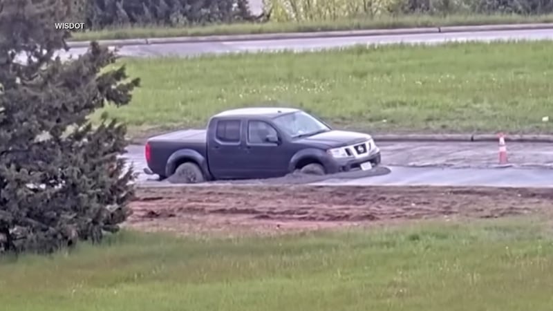 Video from the Wisconsin Department of Transportation shows a pickup truck that got stuck in...