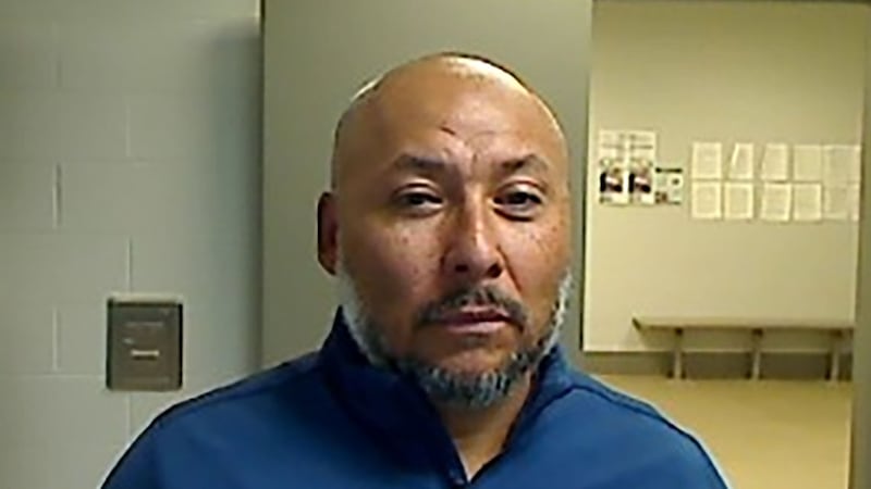 Ismael Ayuzo Sandoval is pictured in an Immigration and Customs Enforcement booking photo.