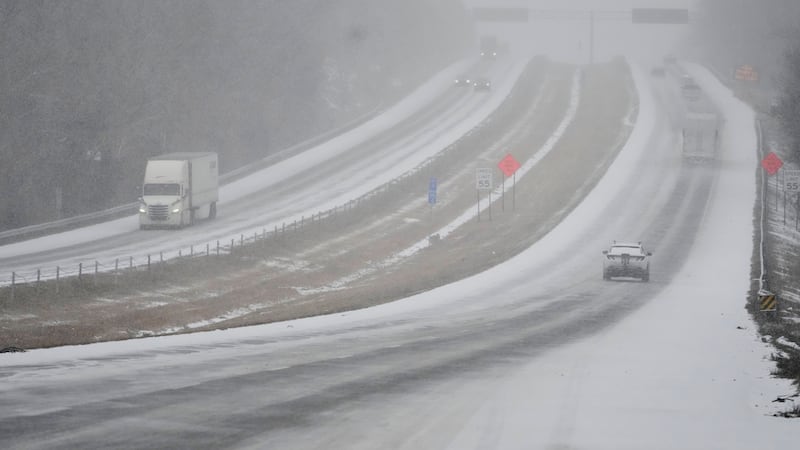 Motorists travel along Interstate 40 during a winter storm Saturday, Jan. 24, 2026, in...