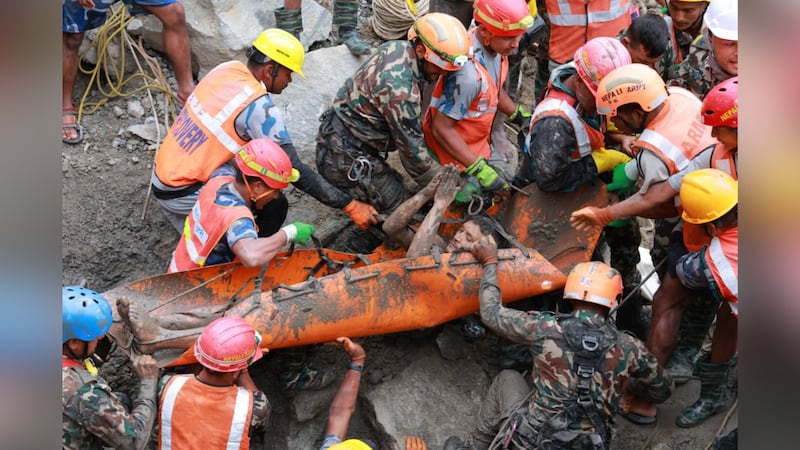 Rescuers in Nepal pulled two workers alive from a hydropower tunnel Friday.