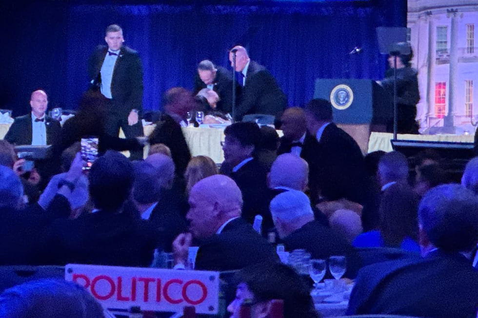 Secret service agents respond during the White House Correspondents Dinner, Saturday, April...