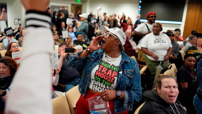People protest in a Senate committee meeting during a special session of the state legislature...