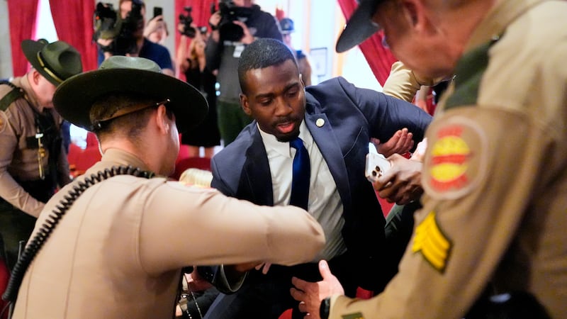KeShaun Pearson is arrested and removed from the House gallery by state troopers during a...