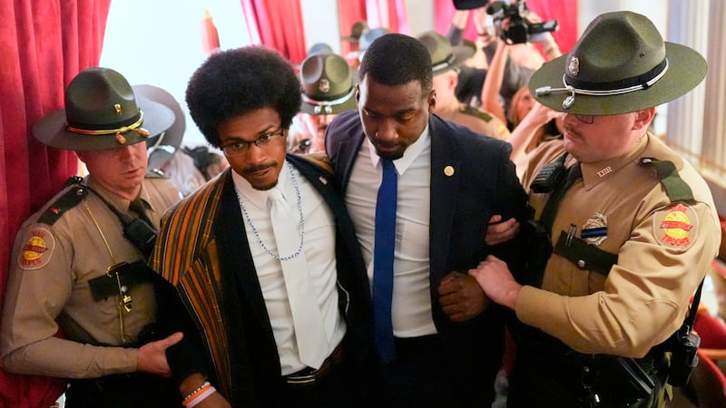 Rep. Justin J. Pearson, D-Memphis, second from left, walks with his brother KeShaun Pearson,...